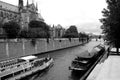 Tourist boat floats on the channel near Notre Dame de Paris. Royalty Free Stock Photo